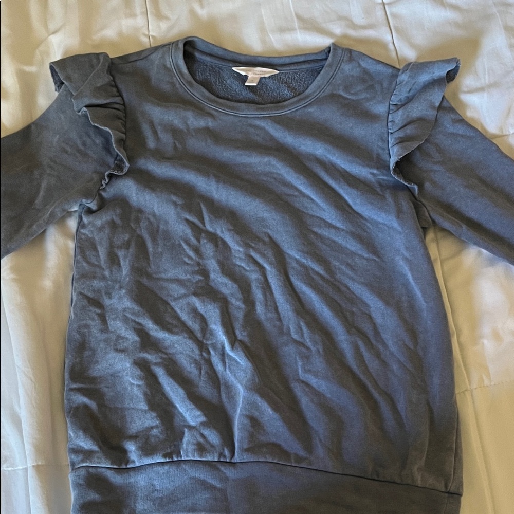 ruffled blue sweater